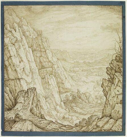 Vallée étendue, vue entre deux hauteurs rocheuses