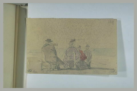 Famille assise sur la plage, image 1/1