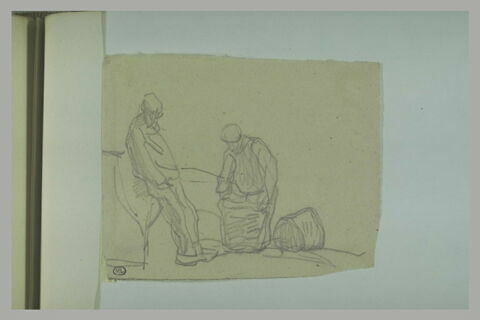 Deux hommes dont l'un manie un fardeau, image 1/1