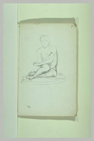 Figure assise au sol, image 2/2