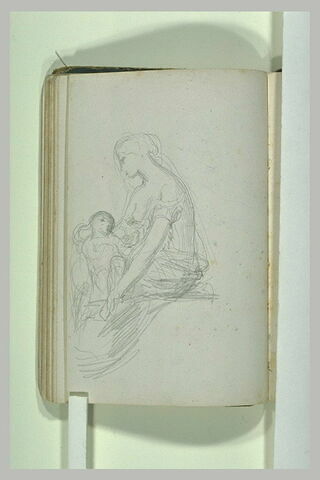 Femme assise, à moitié dévêtue, un enfant dans les bras, image 2/2