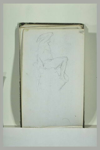 Vue de profil d'une statue d'homme nu, assis, image 1/1