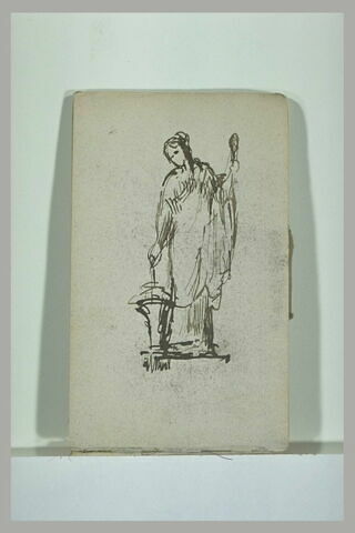 Femme tenant une quenouille et un rouet