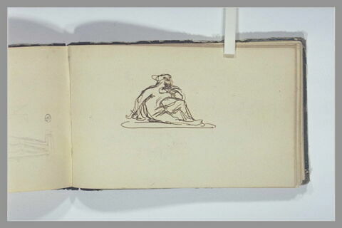 Une figure assise à terre, image 1/1