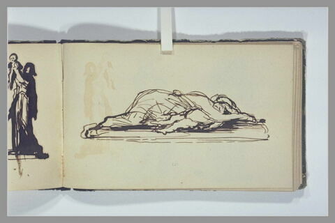 Une femme et un enfant allongés à terre, image 1/1