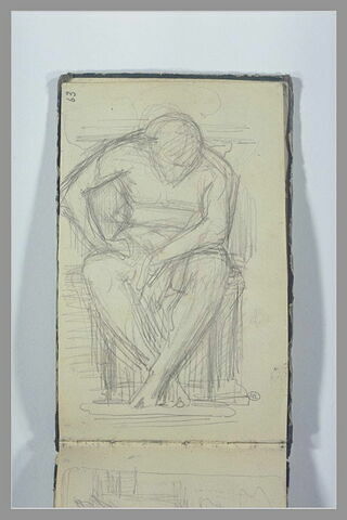 Un homme assis, la tête penchée, image 1/1
