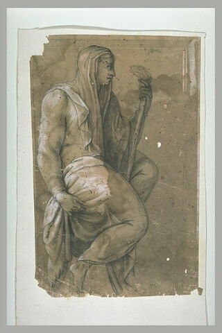 Femme assise, la tête couverte d'un voile, tenant un bâton (?), de profil vers la droite