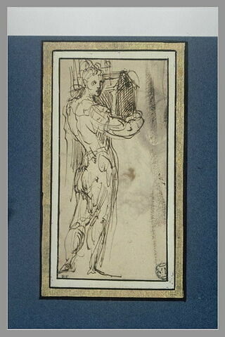Figure d'homme debout portant un objet dans les bras (une maquette?), image 1/1