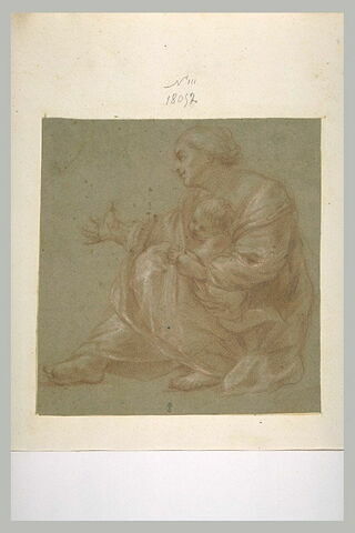 Femme assise à terre, tenant un enfant et tendant la main, image 1/1