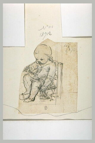 Un enfant assis sur une petite chaise, image 1/1