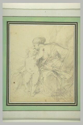 Femme assise embrassant un enfant, image 1/1