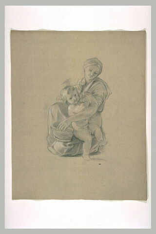 Femme assise tenant un enfant