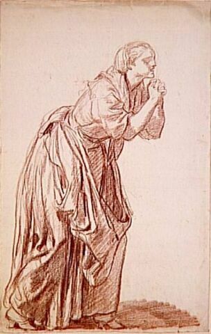 Une femme debout, penchée, les mains jointes, image 3/3