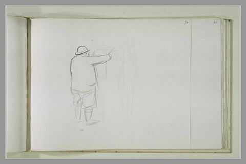 Homme debout, de dos, lisant le journal, image 1/1