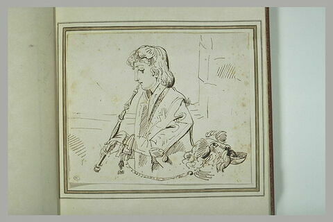 Jeune baladin jouant de la flute auprés d'un chien tenu en laisse, image 1/1