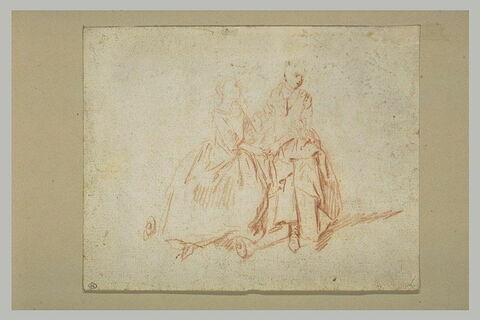 Deux femmes assises, se tenant par la main