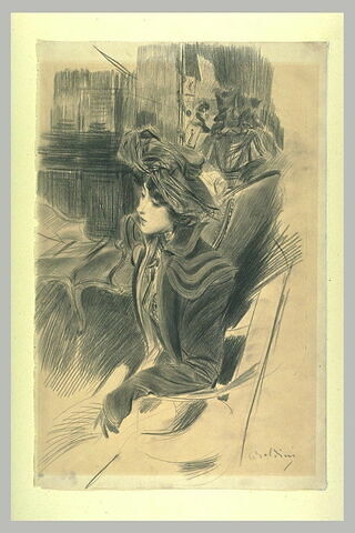 Jeune femme assise dans un intérieur près d'une liseuse, image 2/2