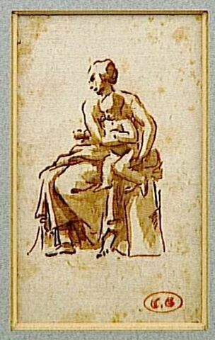 Femme assise portant un enfant