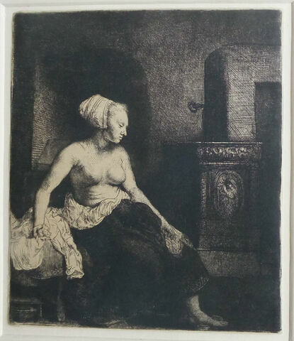 Le femme devant le poêle