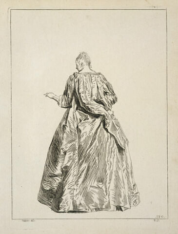 Femme debout, vue de dos, tendant la main gauche, image 1/2
