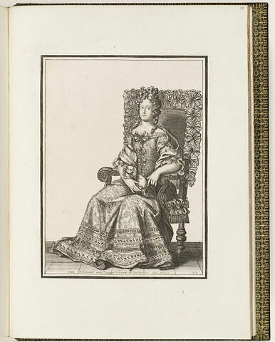 Une femme assise, portant un petit chien sur ses jambes, image 1/1