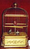 Boîte à musique : petite cage enfermant trois oiseaux chanteurs, image 1/2