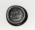Disque orné de signes mystérieux, image 2/2