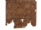 Fragment de tapis à décor d'arabesques et de fleurs de lotus dit 